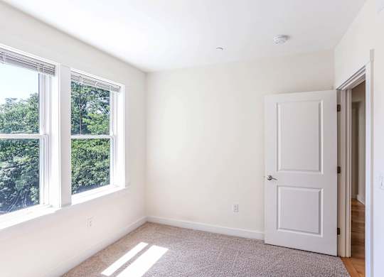 A room with a door and a window at Park87 Apartments, Massachusetts