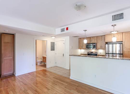 A kitchen with a wooden counter top and a microwave at Park87 Apartments, Cambridge