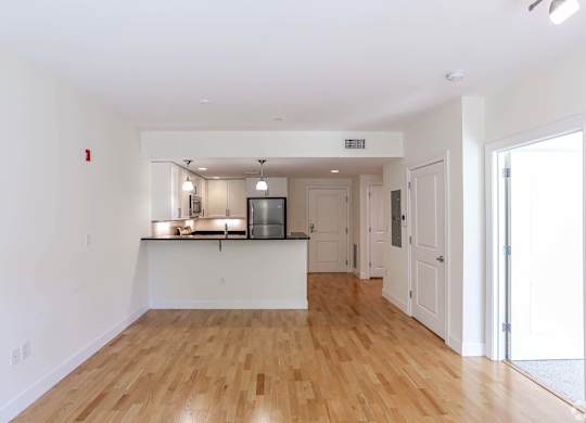 Open kitchen area into a large living room at 7 Cameron Apartments, Cambridge