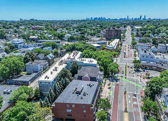 A city street with a crosswalk and a green bike lane at 7 Cameron Apartments, Cambridge, Massachusetts