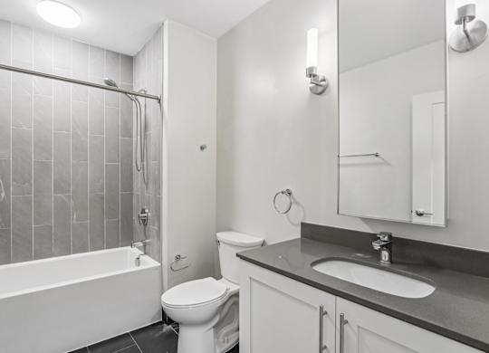 Bathroom with sink and bathtub at Park77 Apartments, Cambridge