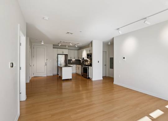 Unfurnished living room with wooden floor at Park77 Apartments, Cambridge, MA, 02138