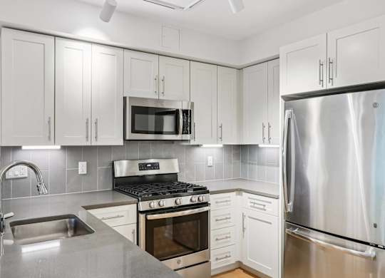 Modern kitchen with refrigerator at Park77 Apartments, Cambridge, Massachusetts