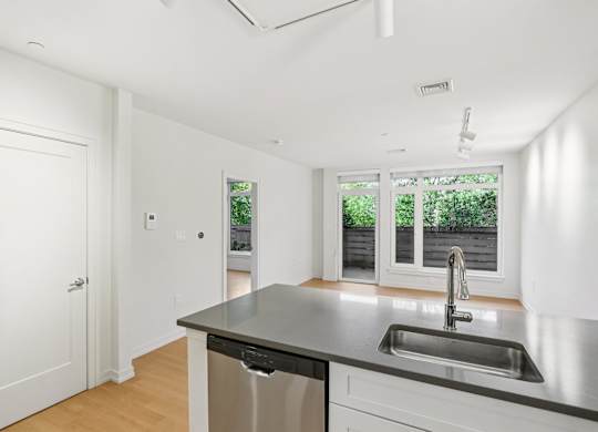 Kitchen with sink and dishwasher at Park77 Apartments, Cambridge, Massachusetts