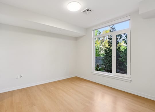 Bedroom with a window at Park77 Apartments, Cambridge