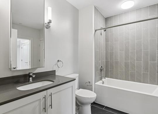 Bathroom with bathtub and toilet at Park77 Apartments, Massachusetts, 02138