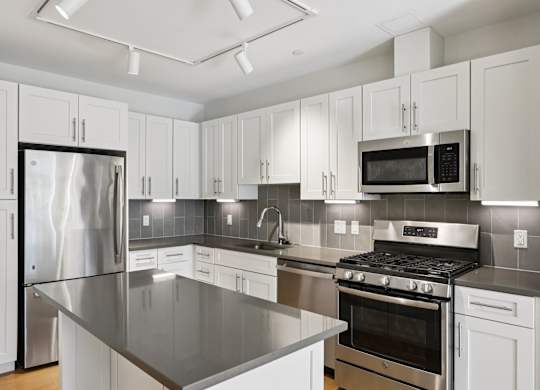Kitchen with white cabinets at Park77 Apartments, Cambridge, MA