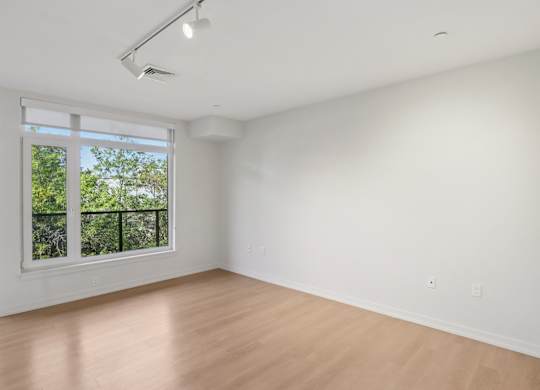 Unfurnished bedroom with sliding door window at Park77 Apartments, Massachusetts, 02138