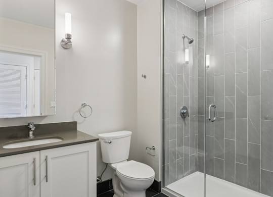 Bathroom with a shower and toilet at Park77 Apartments, Massachusetts