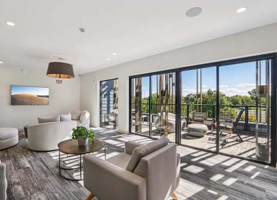 Gorgeous living room with attached patio at Park77 Apartments, Cambridge, Massachusetts, 02138