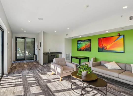 Living room with paintings at Park77 Apartments, Massachusetts