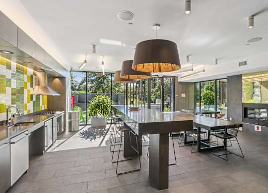 Modern kitchen with a dining table and chairs at Park77 Apartments, Cambridge, Massachusetts, 02138