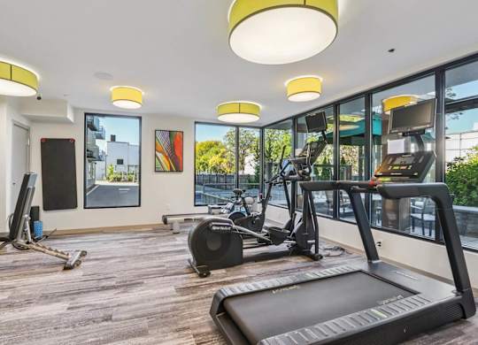Spacious gym with treadmills at Park77 Apartments, Cambridge