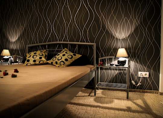 bedroom with black accent wall