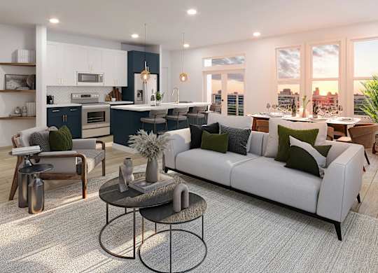 A modern living room with a white sofa and a coffee table.