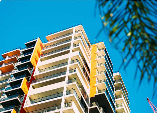 a tall building with a blue sky in the background