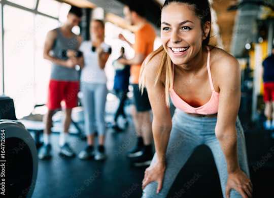 a group of people working out in a gym