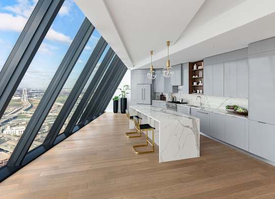A modern kitchen with a view of the city through large windows.