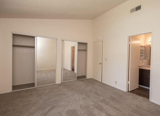 Delta Pointe Schooner 2x2 vacant primary bedroom and bathroom