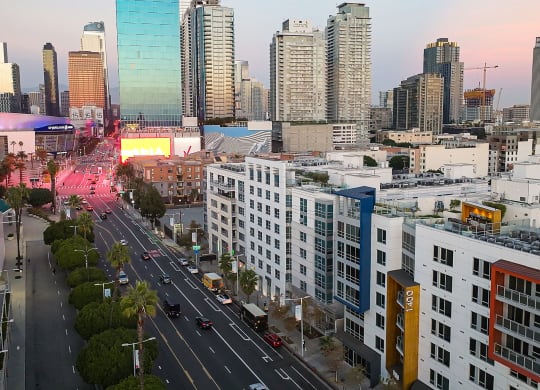 an aerial view of the city at sunset