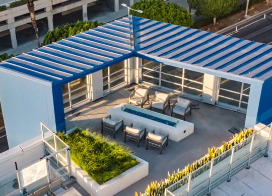 a rendering of a rooftop patio with a pool and a blue roof