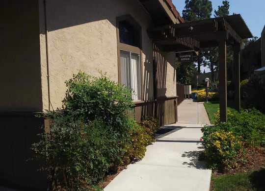 Walkway to leasing office at Teton Pines Apartments in Escondido, California.