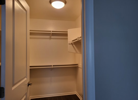 Large walk-in closet in master bedroom at The Cove at Bear Valley in Escondido, California.