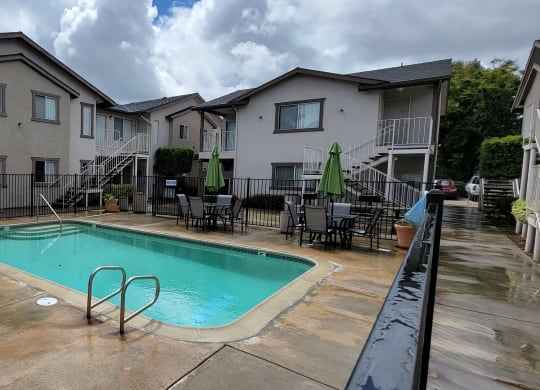 Swimming pool and courtyard area at Lakeshore Terrace Apartments in Lakeside, California.