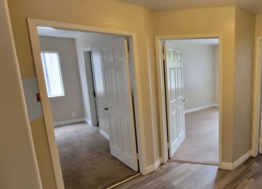 Two bedrooms and bathroom at Lakeshore Terrace Apartments in Lakeside, California.