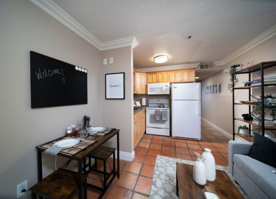 Living view of open kitchen in model apartment at the Atrium Apartments in San Diego, California.