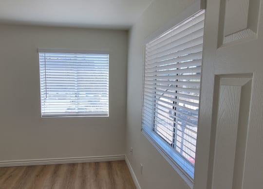 Entry to bedroom with lots of windows in one bedroom apartment at the Atrium Apartments in San Diego, CA.