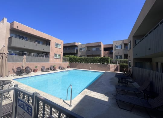 Swimming pool and sun deck at Villa Pacific Apartments in Oceanside, California.