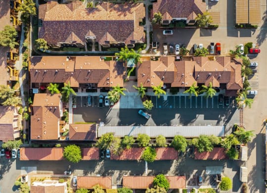 Aerial view of The Nines Townhomes showing parking, and covered parking in Escondido, California.