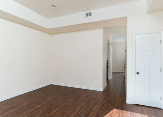 Wood style laminate flooring and high ceilings at The Nines Townhomes in Escondido, California.