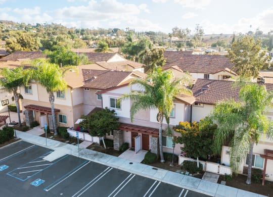Arial view of parking lot and several units at The Nines Townhomes in Escondido, California.