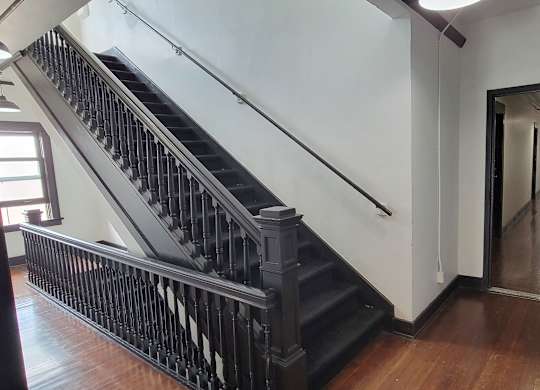 Staircase and wooden floors in the Western at Rosewood apartments in Los Angeles, California.