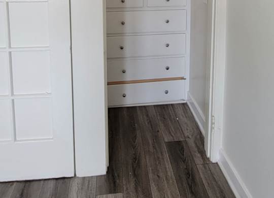 Large closet with built in chest in studio apartment at the Western At Rosewood apartments in Los Angeles, California.