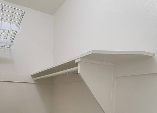 Shelves and built in chest in large closet at the Western At Rosewood apartments in Los Angeles, California.