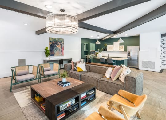a living room filled with furniture and a large chandelier