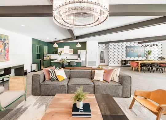 a living room filled with furniture and a large chandelier