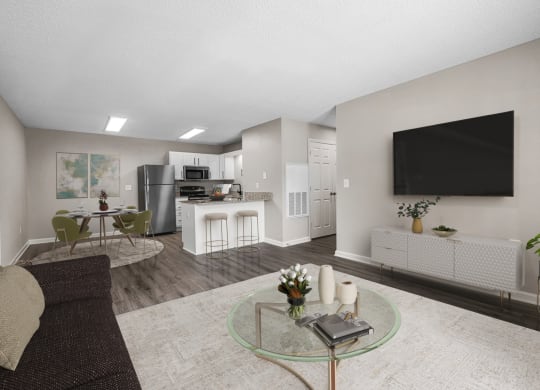 addison point interior staged model an open living room and kitchen with a large screen tv