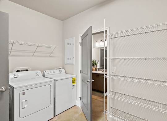A laundry room with a washer and dryer.