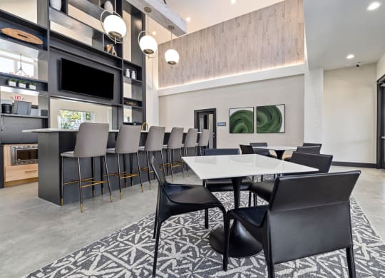 a dining room with a long table and chairs