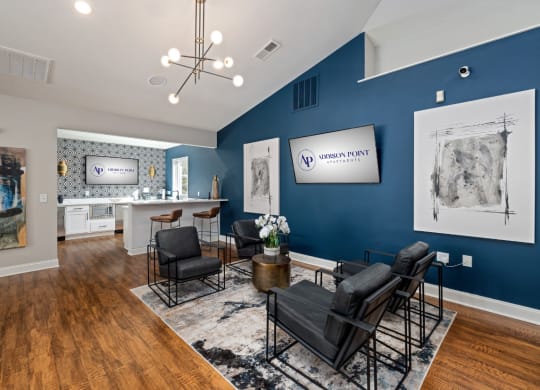 addison point interior resident lounge with blue walls and a table and chairs