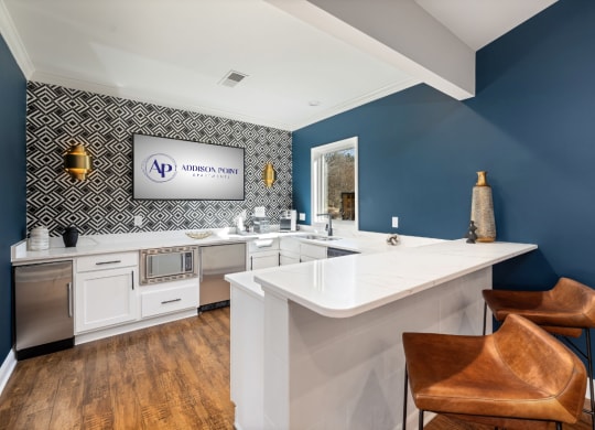 addison point interior resident lounge kitchen with a counter top and two chairs
