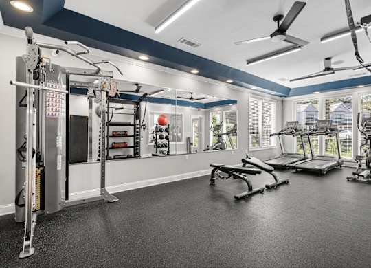 A spacious home gym with a variety of exercise equipment.
