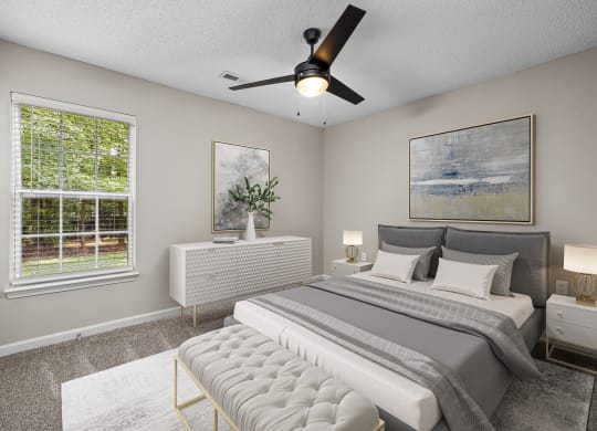 addison point interior staged model bedroom with a bed and a ceiling fan