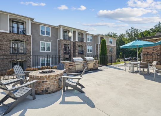 our apartments have a large patio with a fire pit