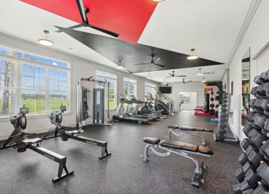 fitness center with weights and benches