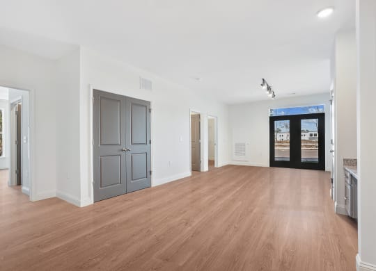 a living room with a hard wood floor and